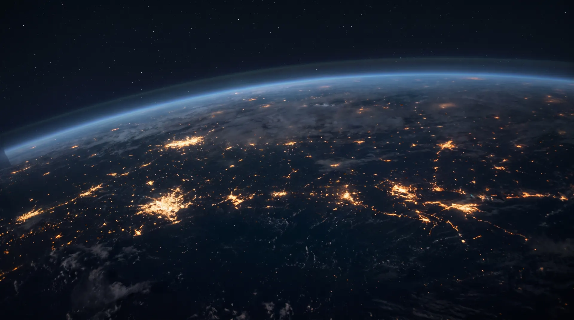 Earth's night side from orbit, city lights across dark landmasses